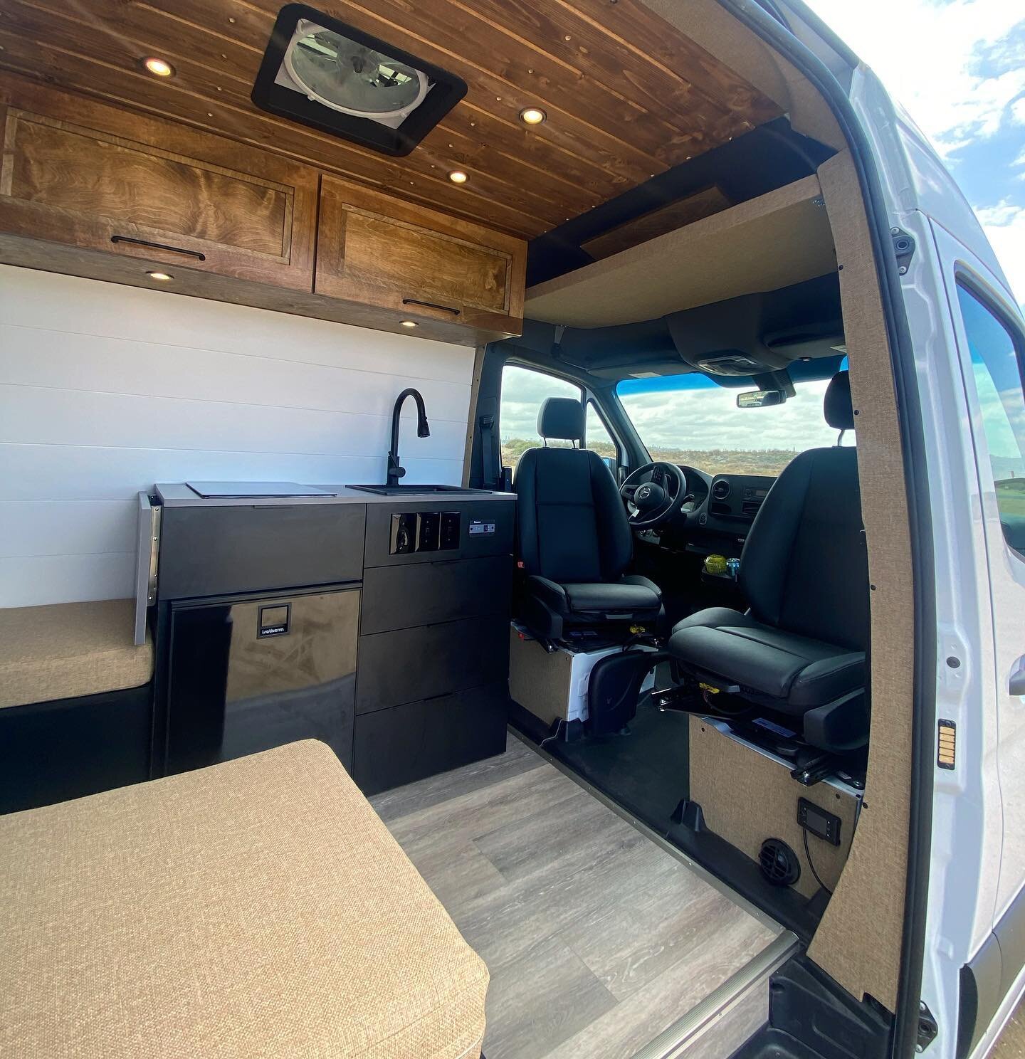 We love the way captain chair swivels open up the space within a layout, and make even a shorter wheelbase van feel so spacious! Our &lsquo;Mountain House 144&rsquo; layout focuses on maximum amenities with a minimal feel.